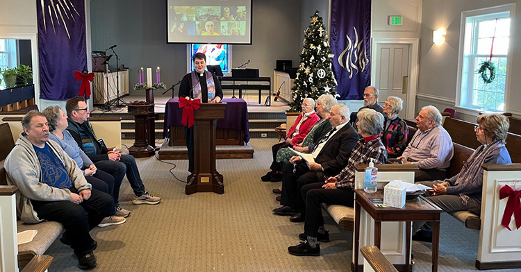 Dr. David Goatley being installed as president of Fuller Theological Seminary in January 2023 Image of a sanctuary where people are seated in a half circle singing together