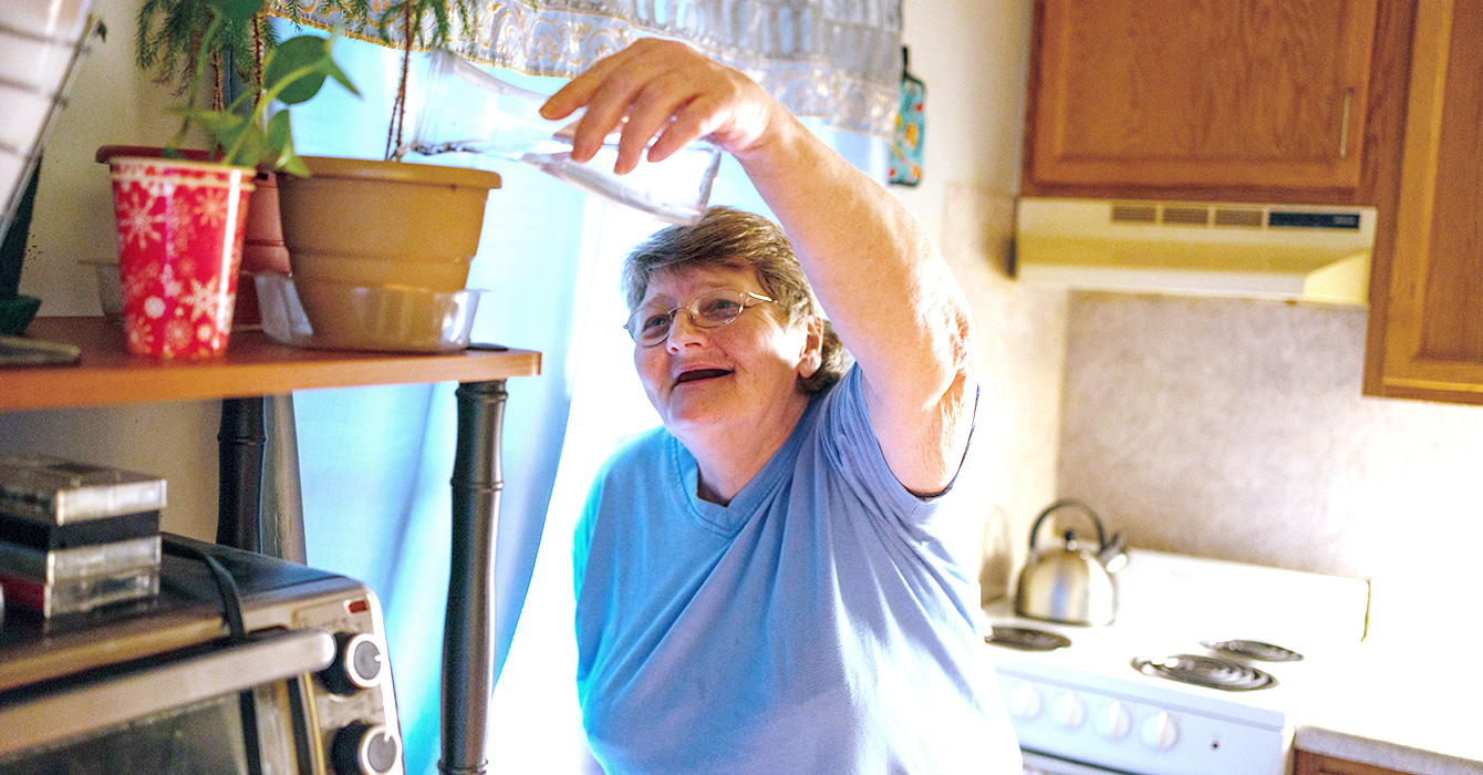 Woman in the kitchen of her home
