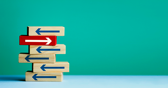 Blocks with arrows pointing left, with one red block pointing right, illustrating innovation