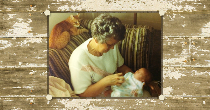 PInky the cat and the author's mother, Carolyn, comfort a fretful baby.