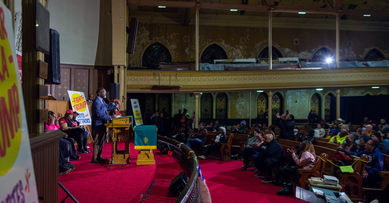 Chicago Mayor Brandon Johnson speaks to a crowd gathered at Quinn Chapel AME Church for an evening meeting about the city of Chicago’s budget.